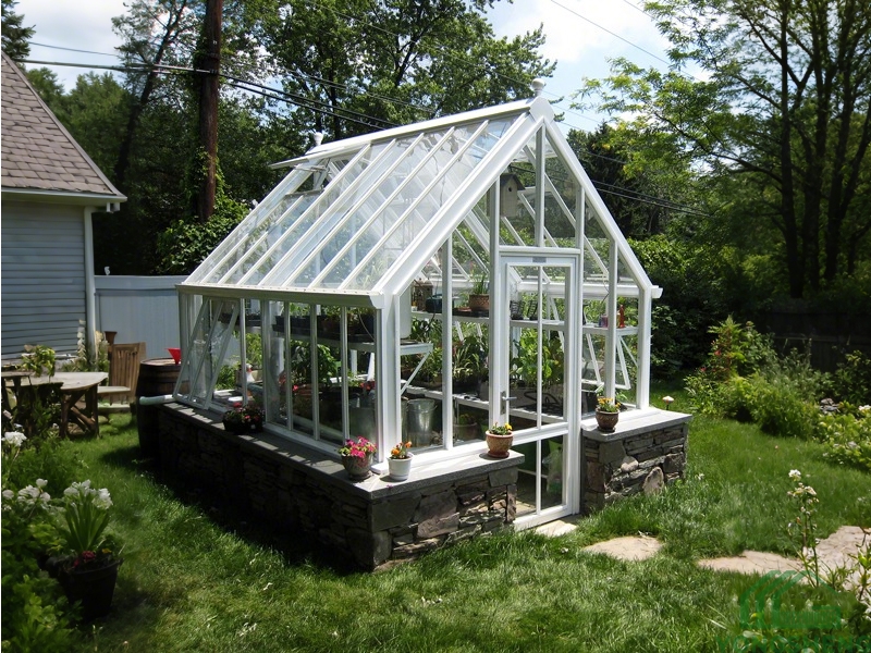 Victorian style steel and glass greenhouse for garden